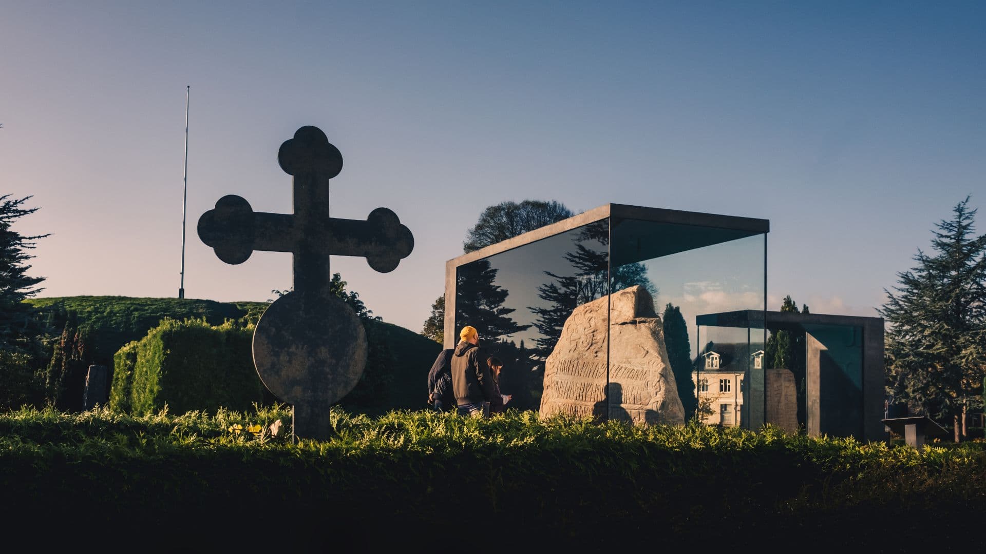 The Jelling monuments, people look at the stones